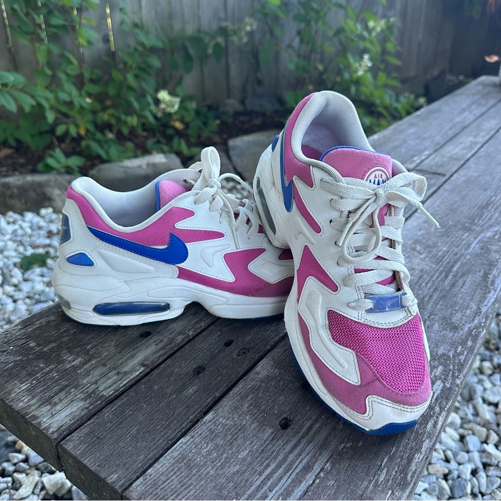 Pink and White Nike Air Max Sneakers with Blue Accents